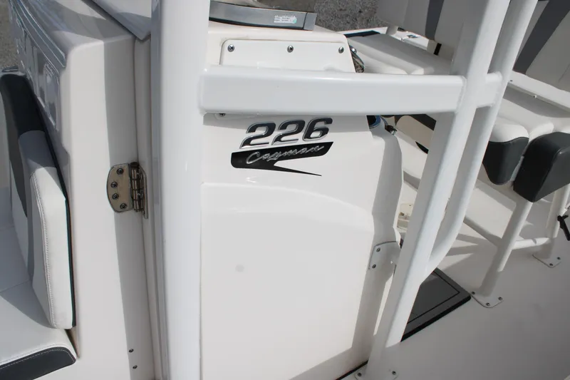 Slide: The Image of 2023 Robalo 226 Cayman boat interior with logo and seating detail. - 25
