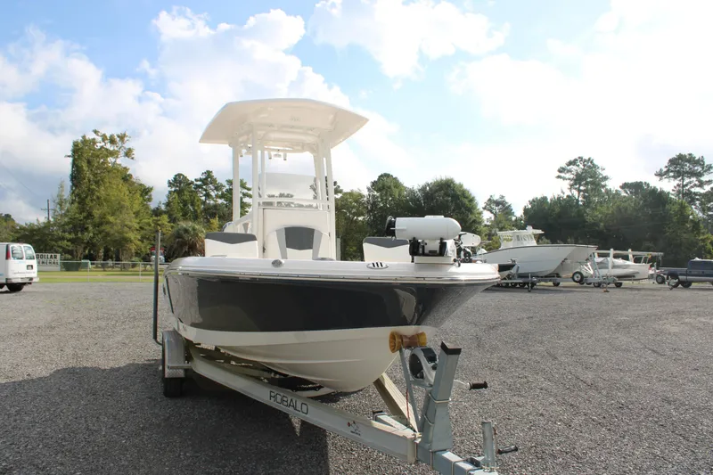 Slide: The Image of 2023 Robalo 226 Cayman boat on trailer in outdoor setting. - 7
