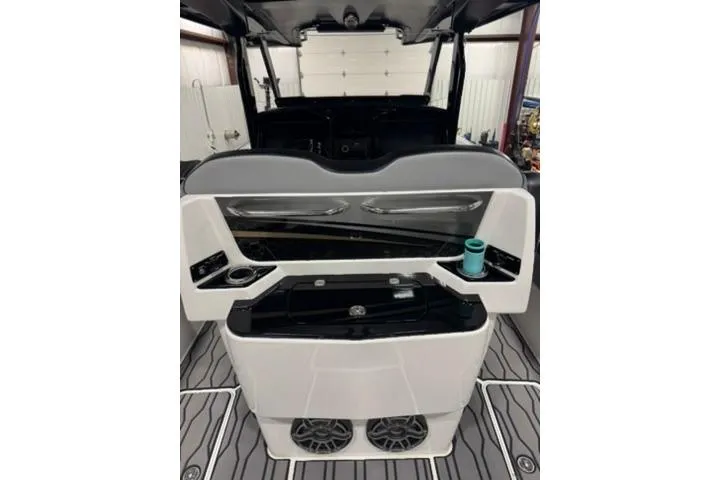 Slide: The Image of 2023 Sunsation 32 CCX boat interior with modern console and sleek design. - 9