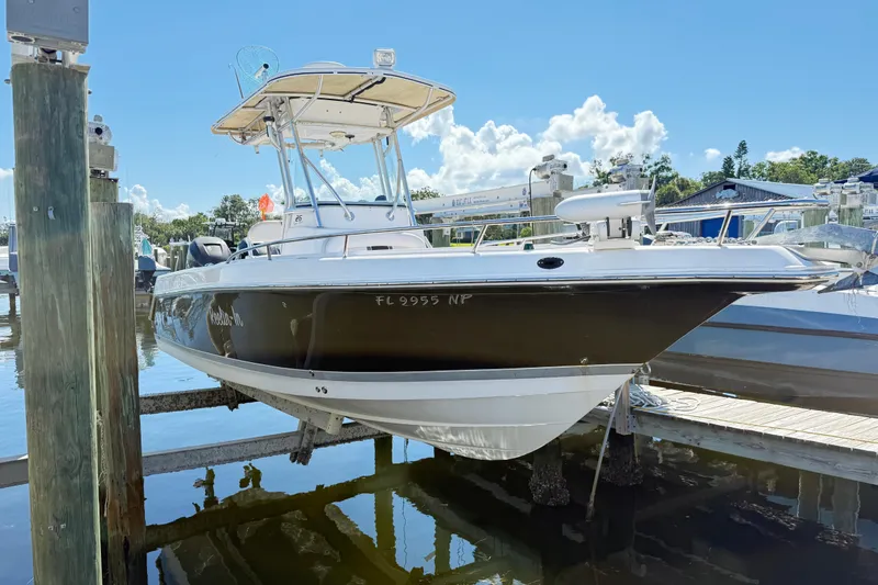 The Image of 2007 Pro-Line 26 Super Sport boat on trailer, featuring Mercury engine. - 0