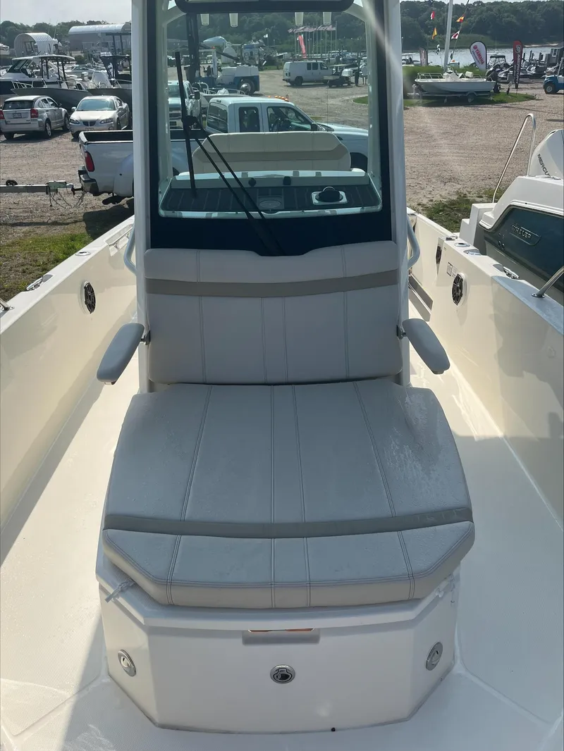 Slide: The Image of 2023 Boston Whaler 280 Dauntless boat interior with storage compartments and seating. - 7