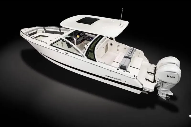 Slide: The Image of 2026 Chaparral 310 OSX boat with Yamaha engines, sleek design, and spacious interior. - 1