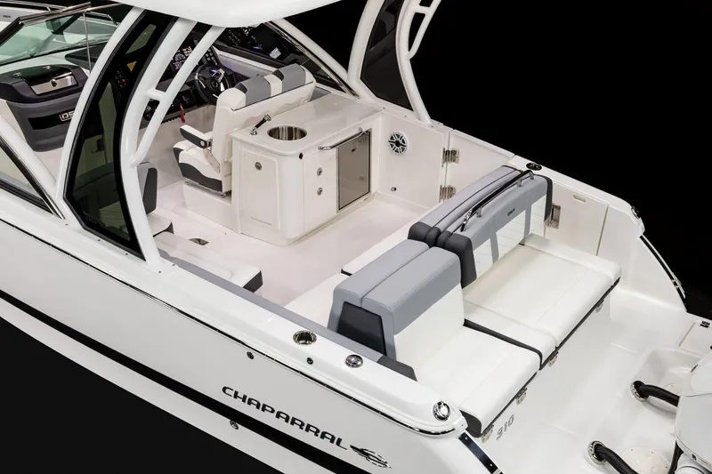 Slide: The Image of 2026 Chaparral 310 OSX boat interior with sleek seating and modern amenities. - 8