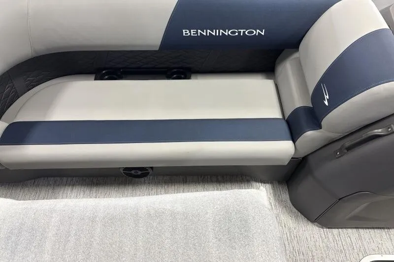 Slide: The Image of 2026 Bennington 22 SSRSE boat interior seating with blue and gray upholstery. - 19