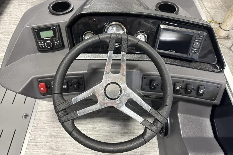 Slide: The Image of Steering console of 2026 Bennington 22 SSRSE boat with modern controls and display. - 22