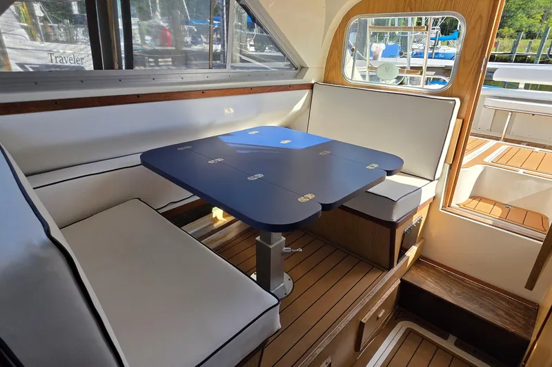 Slide: The Image of Interior of 1983 Bertram 28 Flybridge Cruiser with seating and table. - 18