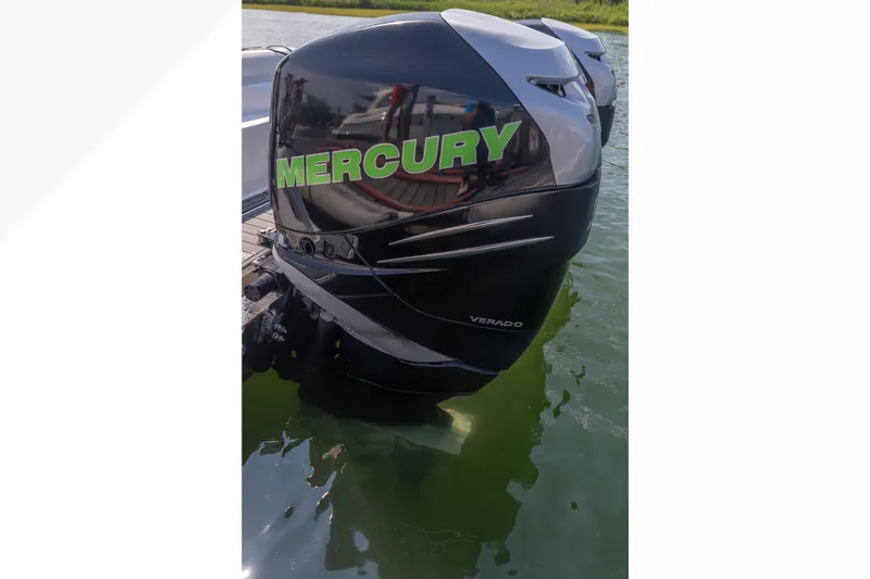 Slide: The Image of 2014 Nor-Tech 390 Sport Cuddy with Mercury Verado engine in water. - 1