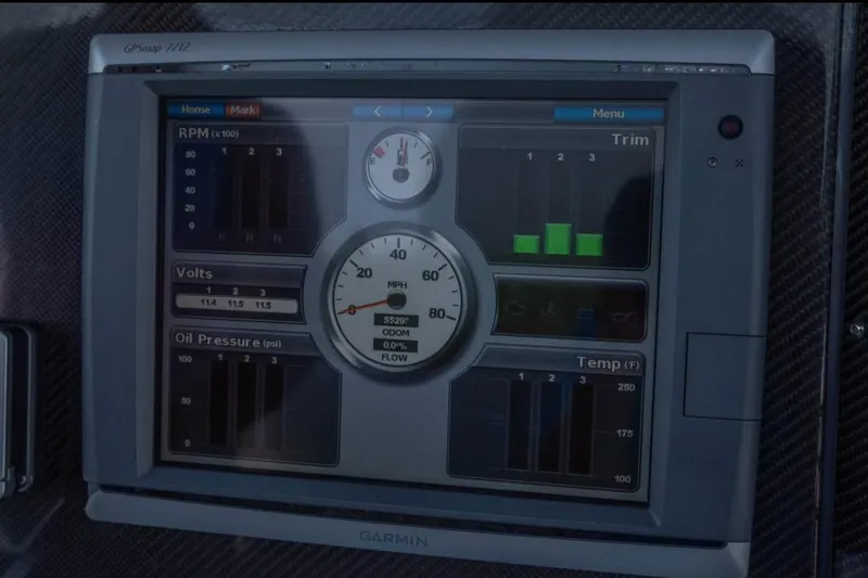 Slide: The Image of Garmin GPS display on 2014 Nor-Tech 390 Sport Cuddy Center Console boat dashboard. - 10