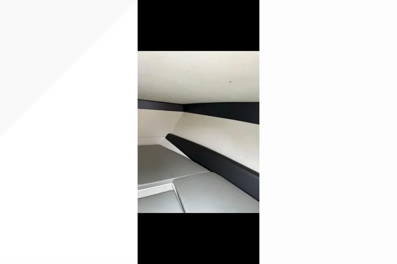 Slide: The Image of 2014 Nor-Tech 390 Sport Cuddy Center Console interior with sleek, modern design. - 7