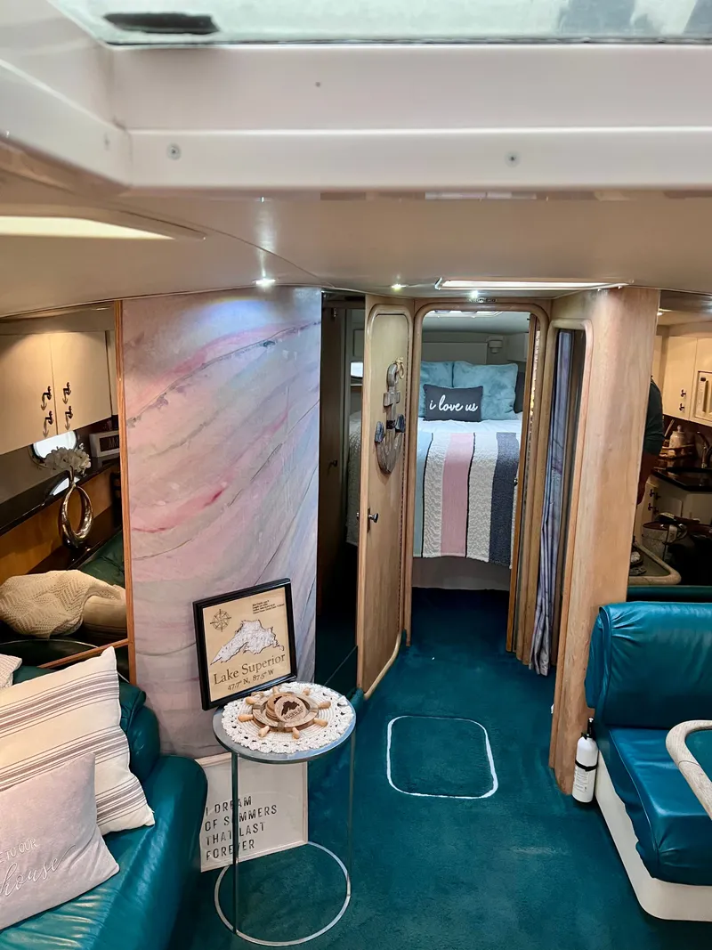 Slide: The Image of Interior of 1992 Wellcraft 43 Portofino yacht with cozy seating and bedroom. - 7