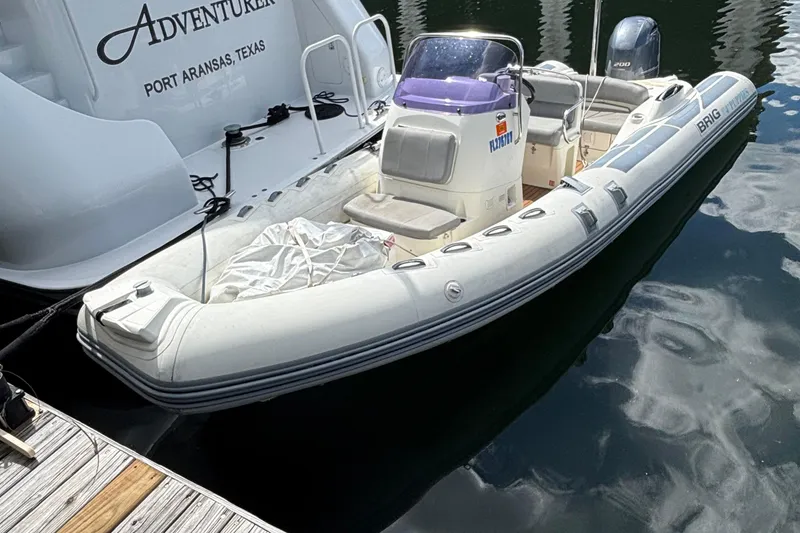 The Image of 2019 Brig Eagle 650 inflatable boat docked beside a yacht in Port Aransas, Texas. - 0