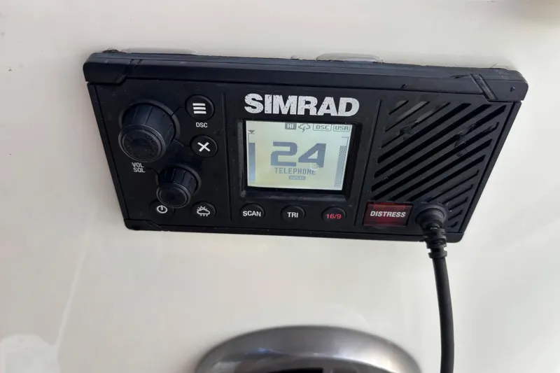 Slide: The Image of Simrad marine radio on 2019 Brig Eagle 650, displaying channel 24. - 16