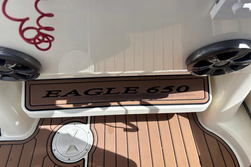 Slide: The Image of 2019 Brig Eagle 650 boat deck with logo and speakers. - 4