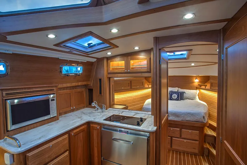 Slide: The Image of Manufacturer Provided Image: Luxurious interior of 2026 Sabre 38 Salon Express yacht with modern kitchen and cozy bedroom. - 10