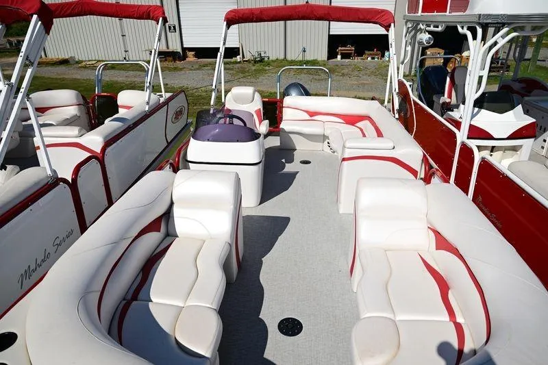Slide: The Image of 2023 Aloha Pontoon Mahalo 23 with spacious seating and red accents. - 11