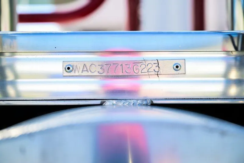 Slide: The Image of 2023 Aloha Pontoon Mahalo 23 serial number plate on metallic surface. - 14