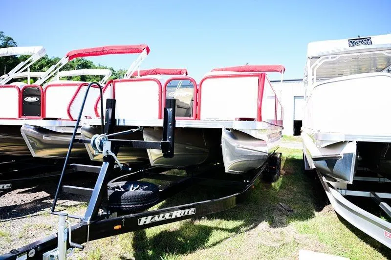 Slide: The Image of 2023 Aloha Pontoon Mahalo 23 boat with red accents on a trailer. - 6