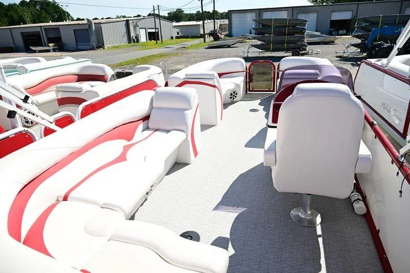 Slide: The Image of 2023 Aloha Pontoon Mahalo 23 interior with white and red seating, spacious layout. - 7