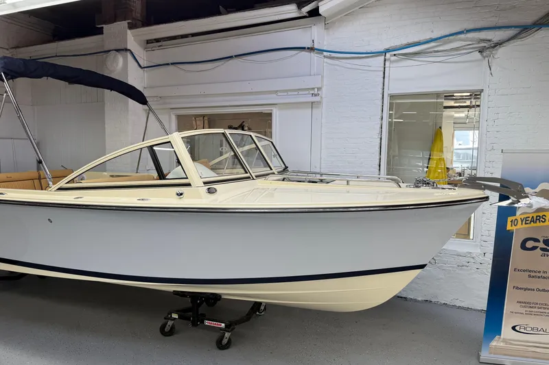 The Image of 2026 Rossiter 23 Classic boat displayed indoors, featuring sleek design and modern amenities. - 0