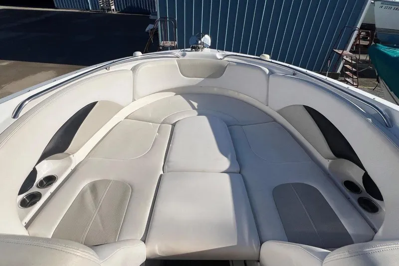 Slide: The Image of 2007 Chaparral 276 SSX boat interior with spacious seating and cup holders. - 14