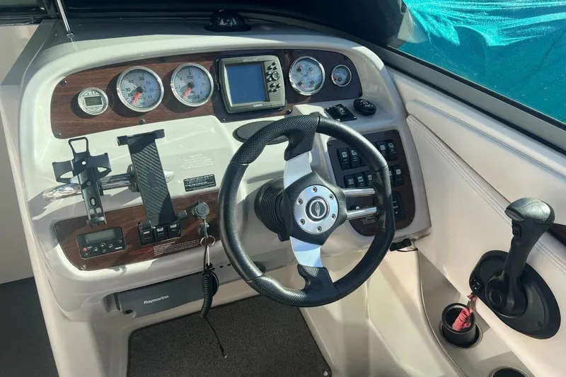 Slide: The Image of 2007 Chaparral 276 SSX boat dashboard with steering wheel and control panel. - 5