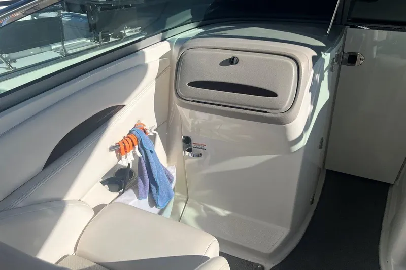 Slide: The Image of Interior of 2007 Chaparral 276 SSX boat, featuring seating and storage compartment. - 6