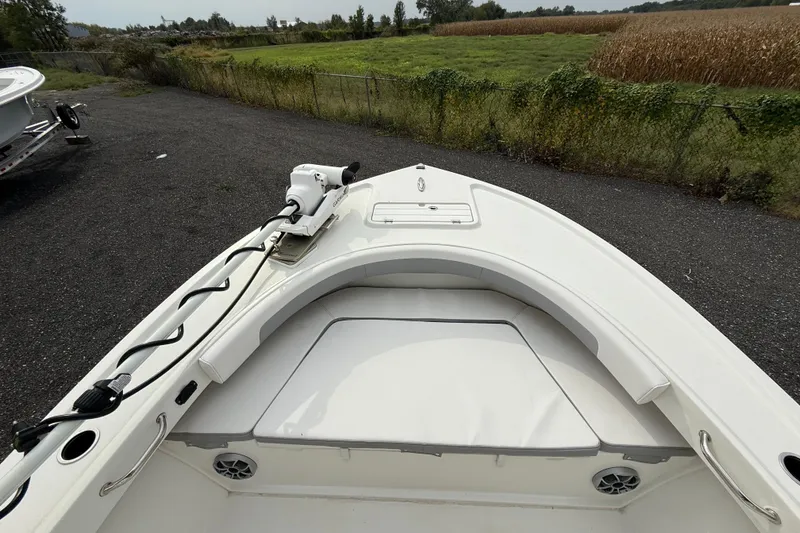 Slide: The Image of 2024 Parker 2300 Special Edition boat with bow seating and trolling motor. - 11