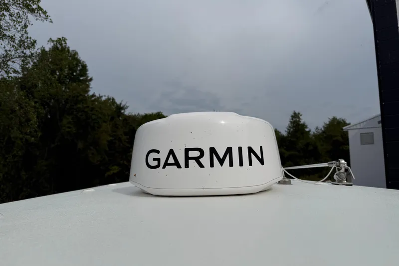 Slide: The Image of Garmin radar on 2024 Parker 2300 Special Edition boat, with overcast sky background. - 15