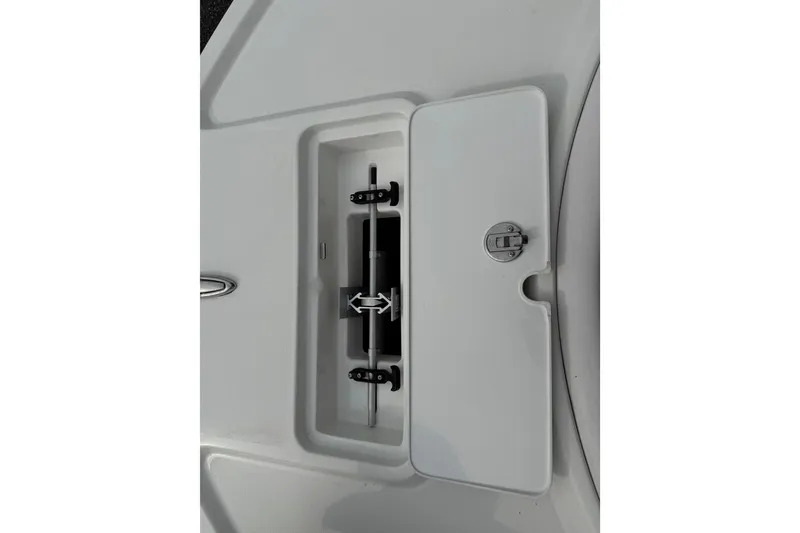 Slide: The Image of 2024 Parker 2300 Special Edition boat compartment with secure latch and sleek design. - 18