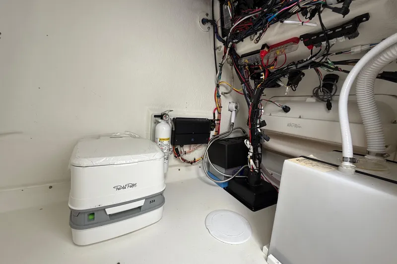 Slide: The Image of 2024 Parker 2300 Special Edition boat interior with Porta Potti and wiring. - 21