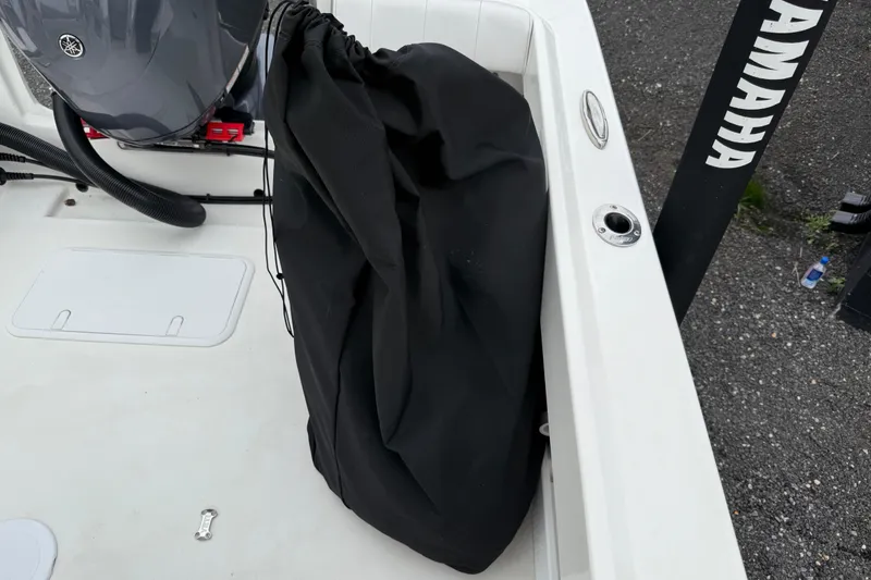 Slide: The Image of 2024 Parker 2300 Special Edition boat with Yamaha engine, black cover, and white deck. - 23