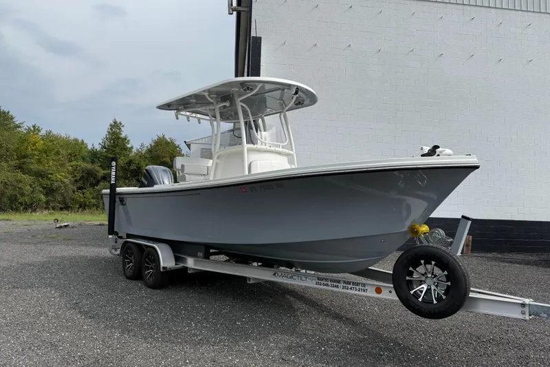 Slide: The Image of 2024 Parker 2300 Special Edition boat on trailer, parked outdoors. - 4