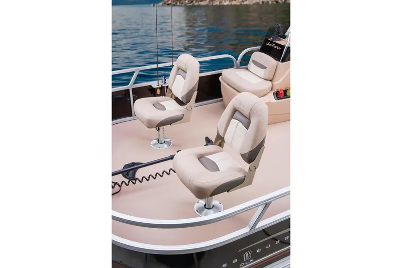 Slide: The Image of 2014 Sun Tracker Bass Buggy 18 DLX steering console with cup holders and seating. - 7