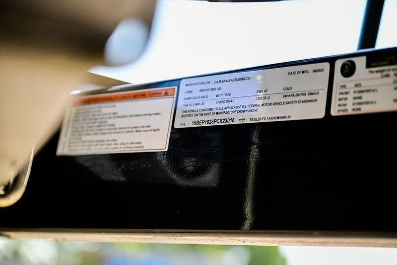 Slide: The Image of Close-up of a 2023 Aloha Pontoon Mahalo 23 label with specifications and VIN details. - 11