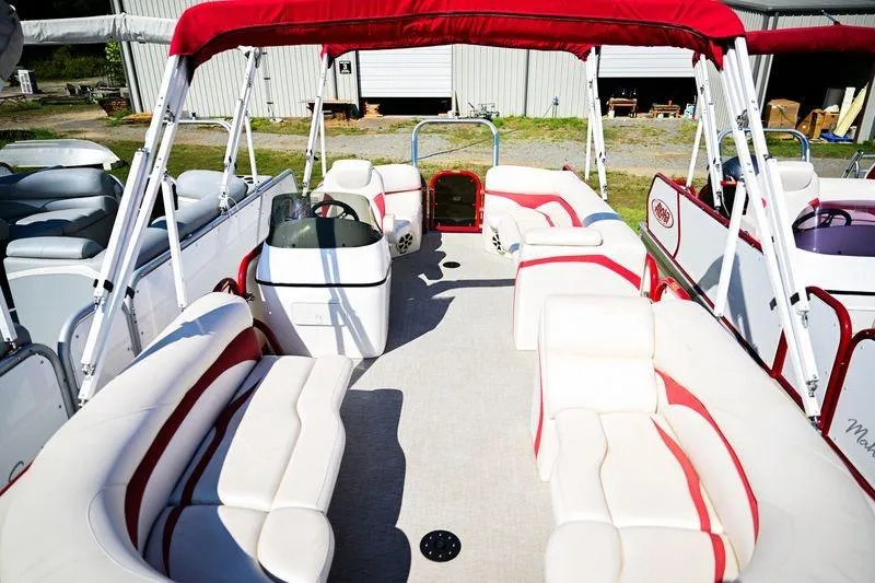 Slide: The Image of 2023 Aloha Pontoon Mahalo 23 with red canopy and spacious seating. - 8