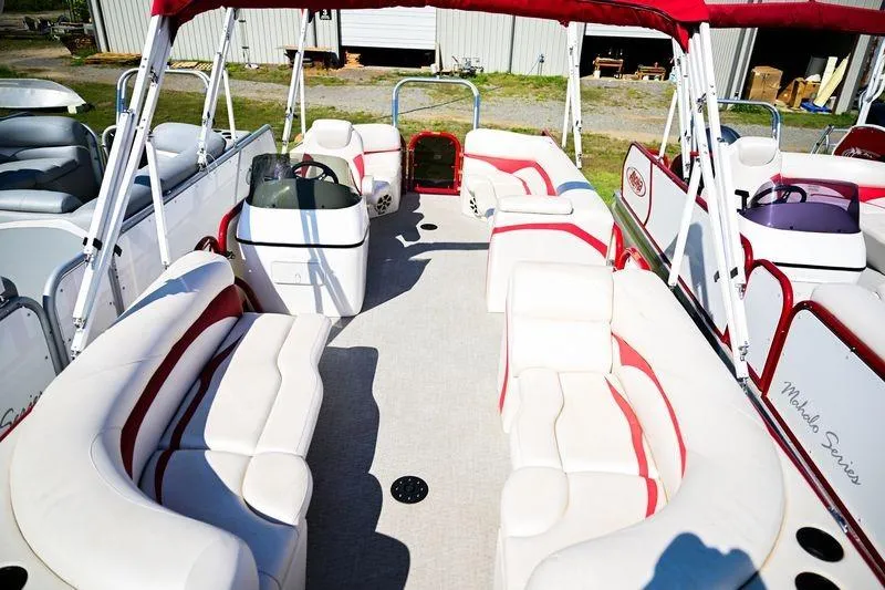 Slide: The Image of 2023 Aloha Pontoon Mahalo 23 with spacious seating and red accents. - 9