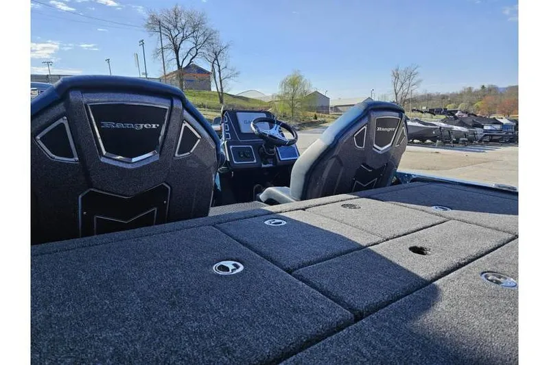 Slide: The Image of 2025 Ranger Z519 Garmin Ranger Cup boat interior with seats and dashboard. - 6