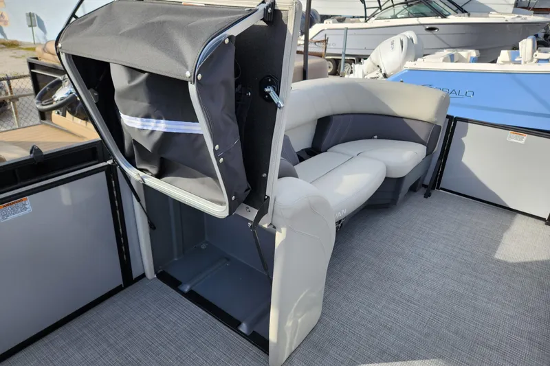 Slide: The Image of 2023 Sylvan X5 boat interior with seating and storage compartment. - 11