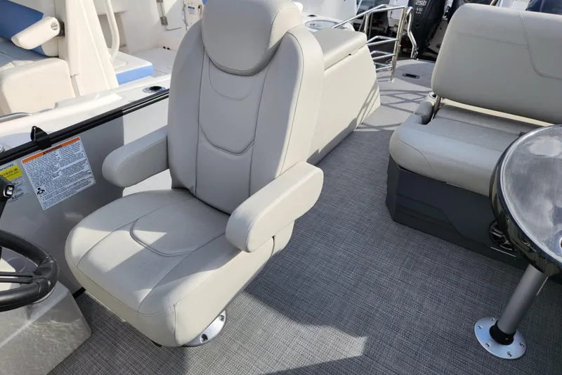 Slide: The Image of 2023 Sylvan X5 boat interior with plush seating and modern design. - 13