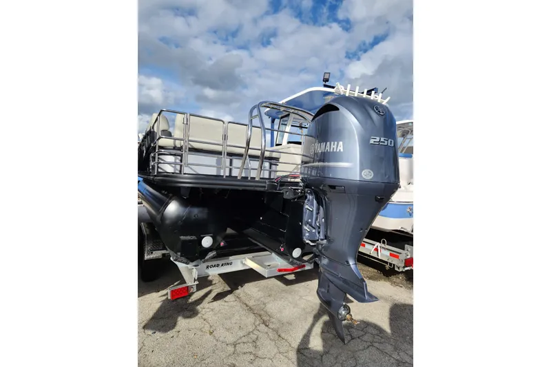 Slide: The Image of 2023 Sylvan X5 boat with Yamaha 250 outboard motor on trailer. - 2