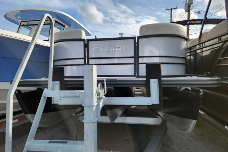 Slide: The Image of 2023 Sylvan X5 pontoon boat on trailer, displayed outdoors. - 3
