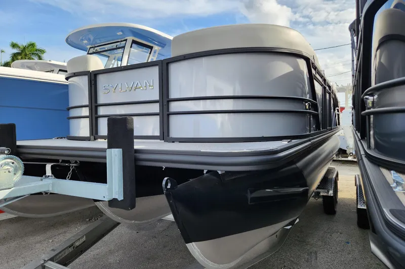 Slide: The Image of 2023 Sylvan X5 pontoon boat on trailer, showcasing sleek design and modern features. - 4