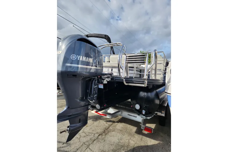 Slide: The Image of 2023 Sylvan X5 boat with Yamaha outboard motor, rear view on trailer. - 5