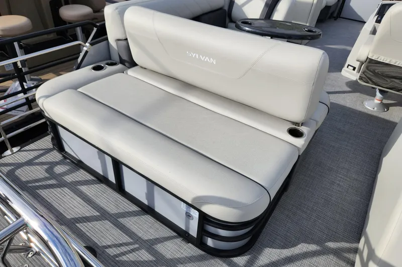 Slide: The Image of 2023 Sylvan X5 boat interior with plush seating and cup holders. - 7