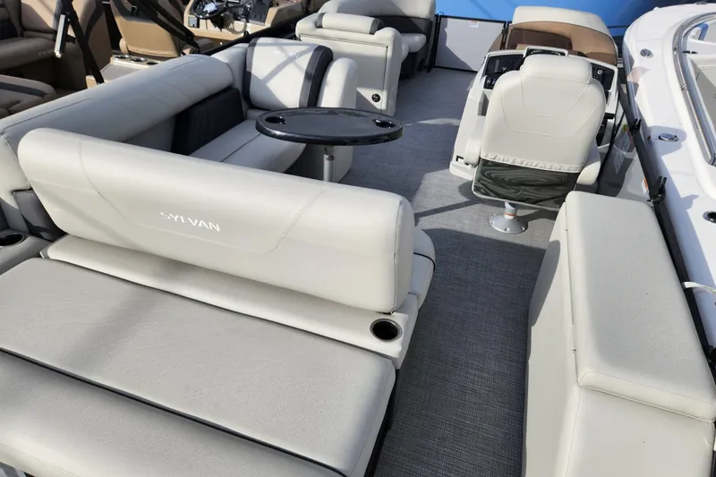 Slide: The Image of 2023 Sylvan X5 boat interior with plush seating and modern design. - 8