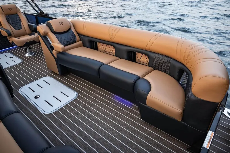 Slide: The Image of Luxurious seating on 2026 Premier 270 Intrigue RF boat, featuring elegant tan and black upholstery. - 6