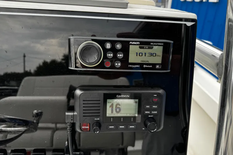 Slide: The Image of Center console of 2021 Parker 2100 with Fusion and Garmin marine electronics. - 11