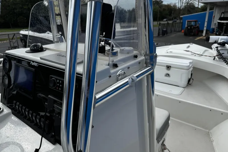 Slide: The Image of 2021 Parker 2100 Center Console boat with navigation equipment and seating area. - 19