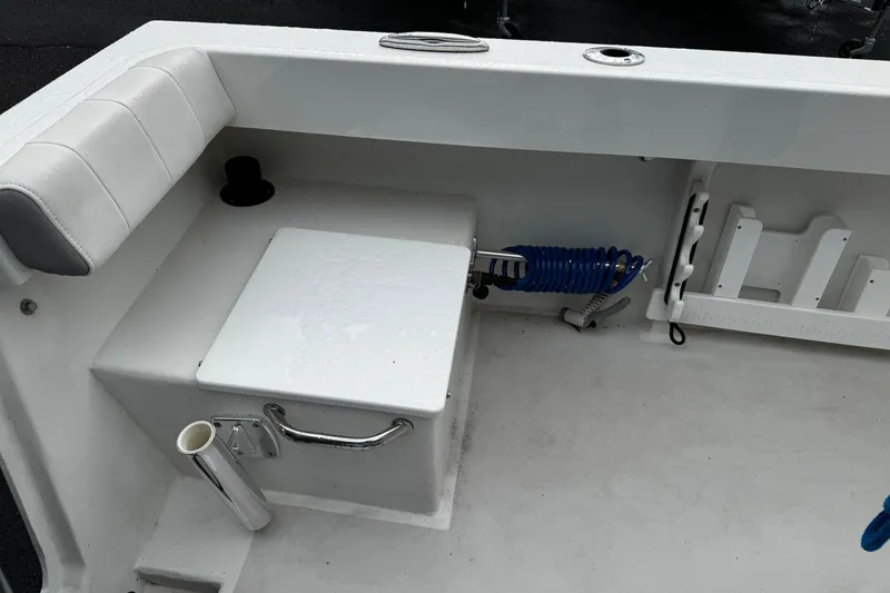 Slide: The Image of 2021 Parker 2100 Center Console boat interior with seating and storage features. - 22