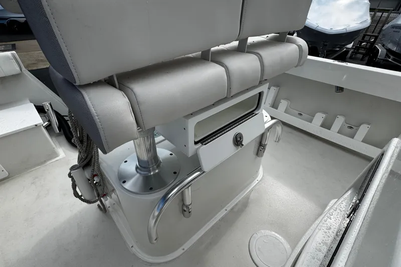 Slide: The Image of 2021 Parker 2100 Center Console boat interior with cushioned seating and storage. - 24
